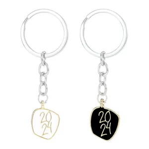 2024 commemorative keychain set in black and white enamel finish with golden engraving