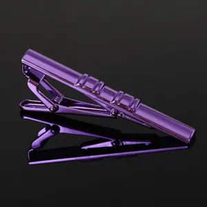 Detailed close-up of a purple electroplated metal tie clip with stylish diagonal grooves