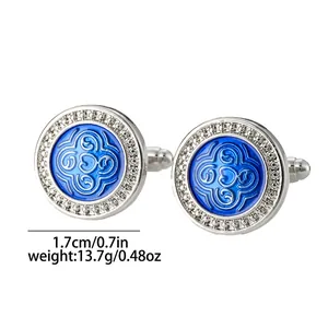 Detailed view of silver cufflinks with blue enamel patterns, showing 1.7cm size and weight