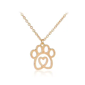 Collana dorata con ciondolo a forma di zampa di cane e cuore con strass da donna