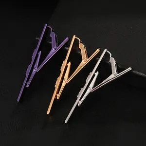 Three-piece set of business tie clips in purple, gold, and silver electroplated metal