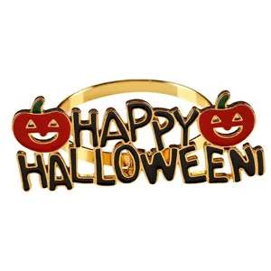 Detalle del servilletero Happy Halloween con base dorada y calabazas rojas