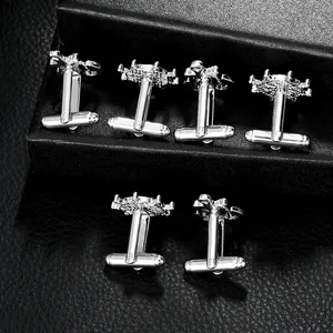 Polished silver nautical cufflinks set featuring ship anchor and helm designs for men