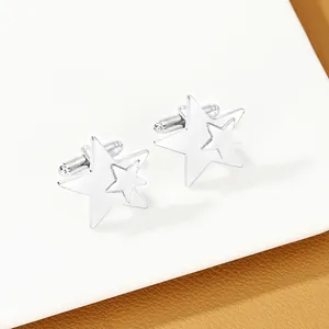 Macro detail of silver star-shaped cufflinks featuring layered geometric pentagon design