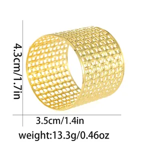 Detailed view of hollow gold metal napkin ring showing 4.3cm height and 3.5cm diameter size