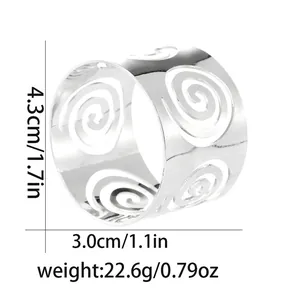 Detailed view of silver hollow spiral napkin ring with dimensions 4.3cm by 3.0cm