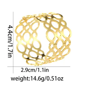 Detail view of gold hollow napkin ring showing dimensions 4.4cm height and 2.9cm diameter