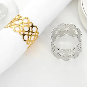 Detailed close-up of hollow alloy napkin rings in gold and silver plating