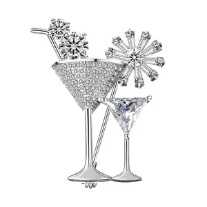 Detailed view of cocktail glass brooch in silver finish with sparkling zircon crystals