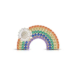 Macro shot of rainbow brooch with colorful gemstones and a sparkling sun flower detail