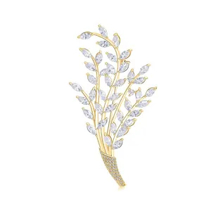 Elegant gold leaf brooch with marquise-cut zircons for formal evening wear