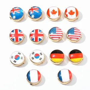 Detailed macro view of round national flag cufflinks featuring high-gloss glass and gold-toned metal