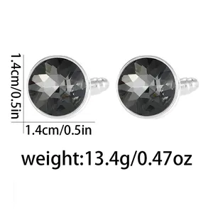 Detail view of round silver cufflinks with faceted grey stone, 1.4cm diameter and 13.4g weight