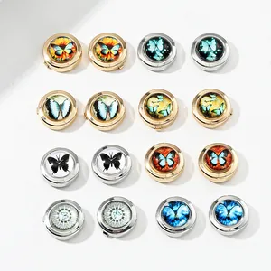 Detailed selection of round butterfly cufflinks in various artistic patterns and finishes