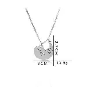 Detailed sloth pendant measurements showing 3cm width and 2.7cm height on silver metal