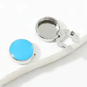 Formal silver cufflink with polished blue inlay and secure metal back attachment