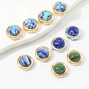 Detailed macro shot of vintage luxury cufflinks with assorted marble and floral patterns