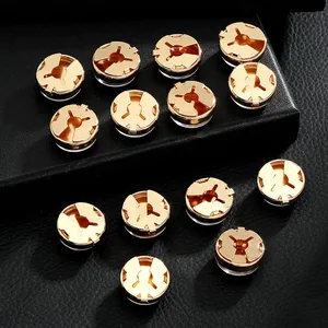 Polished gold round German flag cufflinks set displayed on premium black leather