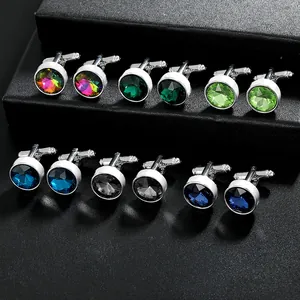 Detail view of round men's cufflinks with faceted multi-color stones in silver alloy base