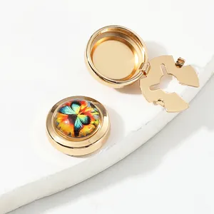 Polished gold round cufflinks with colorful butterfly glass cabochon and hinged opening