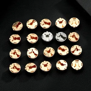 Detailed view of 20 premium metal cufflinks in gold and silver finish on black leather