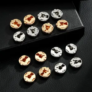 Detailed close-up of premium round metal cufflinks in gold and silver finish on leather
