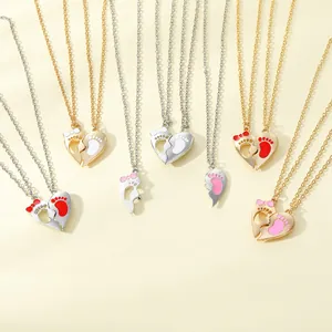 Couple heart pendant necklace with baby footprints and enamel charms in gold and silver