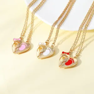 Heart-shaped footprint necklaces in pink, white, and red with gold alloy chains
