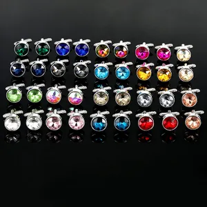 Macro view of assorted colorful crystal cufflinks with silver metal T-bar bases