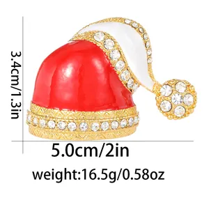 Detail view of red Christmas hat brooch with rhinestones showing dimensions 3.4cm by 5.0cm
