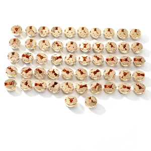 Detailed view of bulk circular gold metal shirt cufflinks with three-claw fastener design