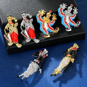 Detail of vintage circus clown brooches with colorful enamel and sparkling rhinestones
