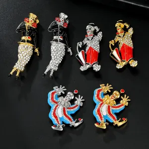 Detail of vintage circus clown brooches with colorful enamel and sparkling rhinestones