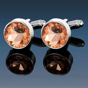 Detailed view of champagne crystal cufflinks with polished silver metal setting