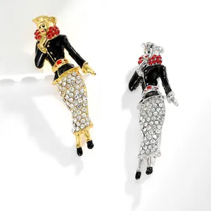 Close-up of vintage circus clown brooches with black enamel and sparkling rhinestones