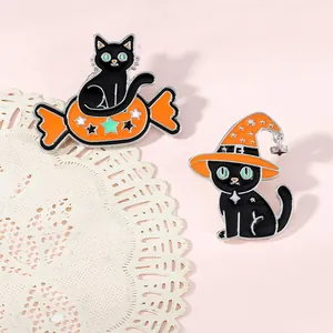 Detail of Halloween black cat enamel pins set with wizard hat and candy elements