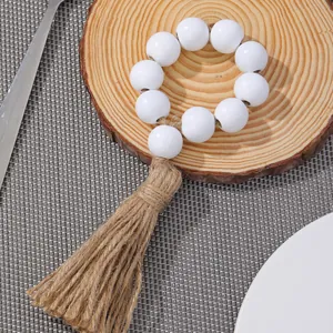 Rond de serviette bohème en perles de bois blanc avec gland en jute pour table rustique