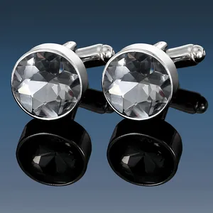 Polished silver-tone cufflinks with large faceted round crystal stones and mirror reflection
