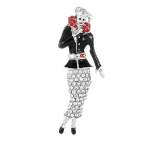 Vintage clown brooch with black enamel and white crystals on a silver base