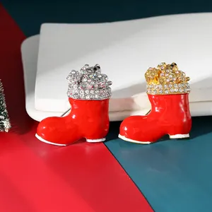Red Christmas boot brooch pins with sparkling rhinestones and festive bear gift elements