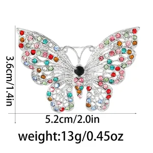 Elegante emaille vlinderbroche met kleurrijke strass steentjes en 5,2 cm breedte maat
