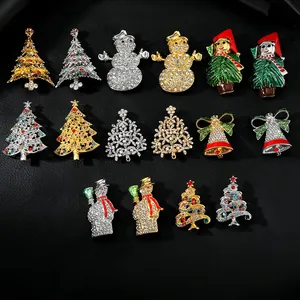 Close-up of enamel Christmas tree and snowman brooches with sparkling rhinestones