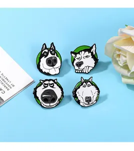 Close-up of four husky enamel pins with funny expressions on a blue background