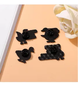 Detailed macro view of black enamel pin backings with secure butterfly clutch fasteners