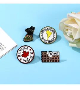 Set of four travel enamel pins featuring Egypt cat, Canada leaf, and Rome landmarks