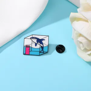 Macro detail of enamel whale badge in surreal cube container with a blue liquid and pink door