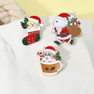 Close-up of three cute Christmas animal pins including a dog in a sock on a white canvas bag