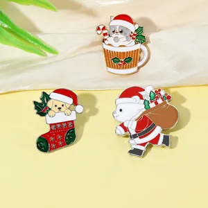 Detailed close-up of cartoon Christmas bear and kitten enamel brooches set for gift decor