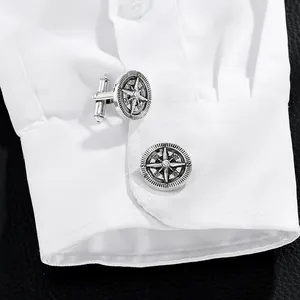 Vintage star compass cufflinks for men in silver finish shown on white shirt cuff