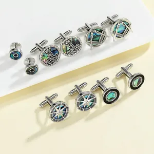 Detail view of silver men's cufflinks set with natural abalone shell inlays